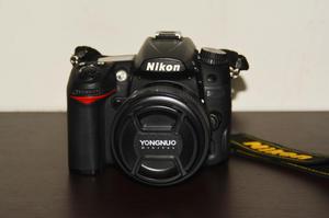 Cámara Reflex Nikon  con lente Yongnuo 50mm bolso