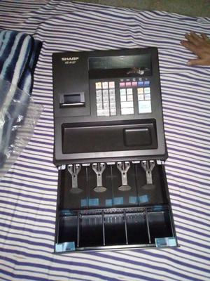 CAJA REGISTRADORA SHARP CON ROLLOS.