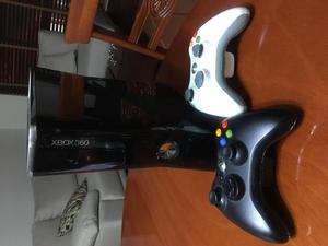 Xbox 360 slim usado con 2 controles y 23 juegos originales y