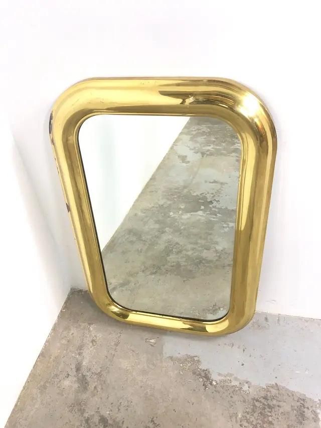 espejo con marco de bronce