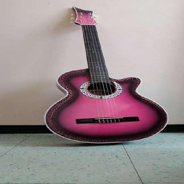 Vendo hermosa guitarra rosada