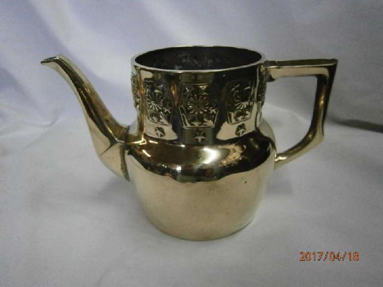 TETERA EN BRONCE CON ESTRELLAS Y FLORES