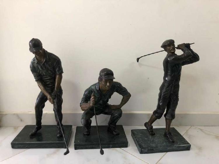 esculturas de golfistas
