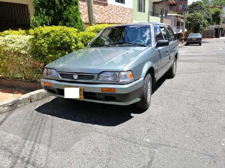 VENDO CARRO FAMILIAR MAZDA 323 SW -1500cc -1991